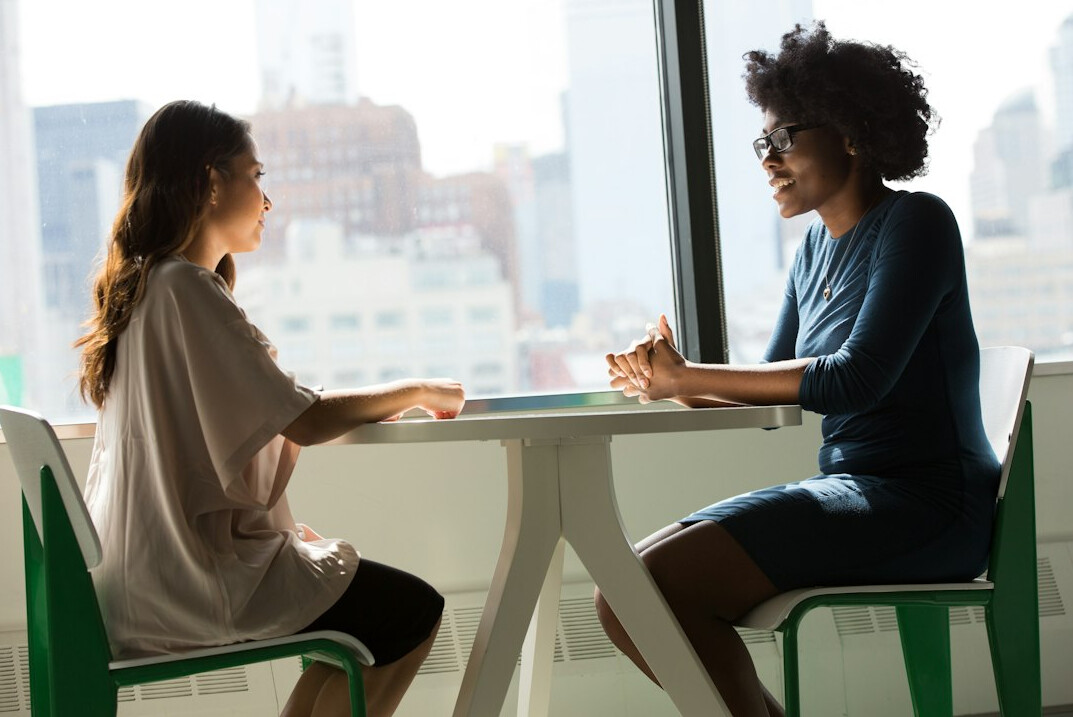 two people in deep conversation